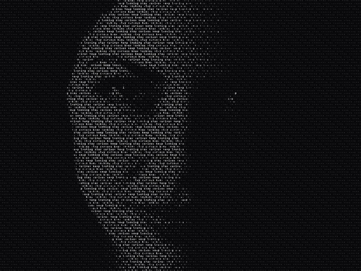 A face built from cream-colored words on a dark background, with larger letters in the highlights.
